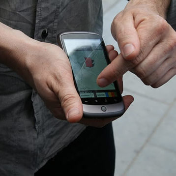 Person playing Exploding Places game on a mobile phone