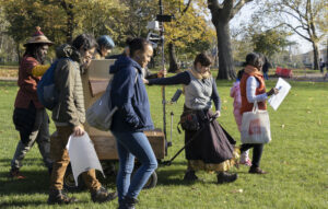 a group of people walking with Future Machine through Finsbury Park
