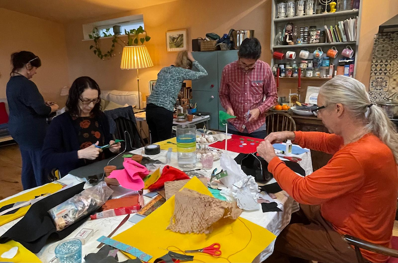 people working with craft materials